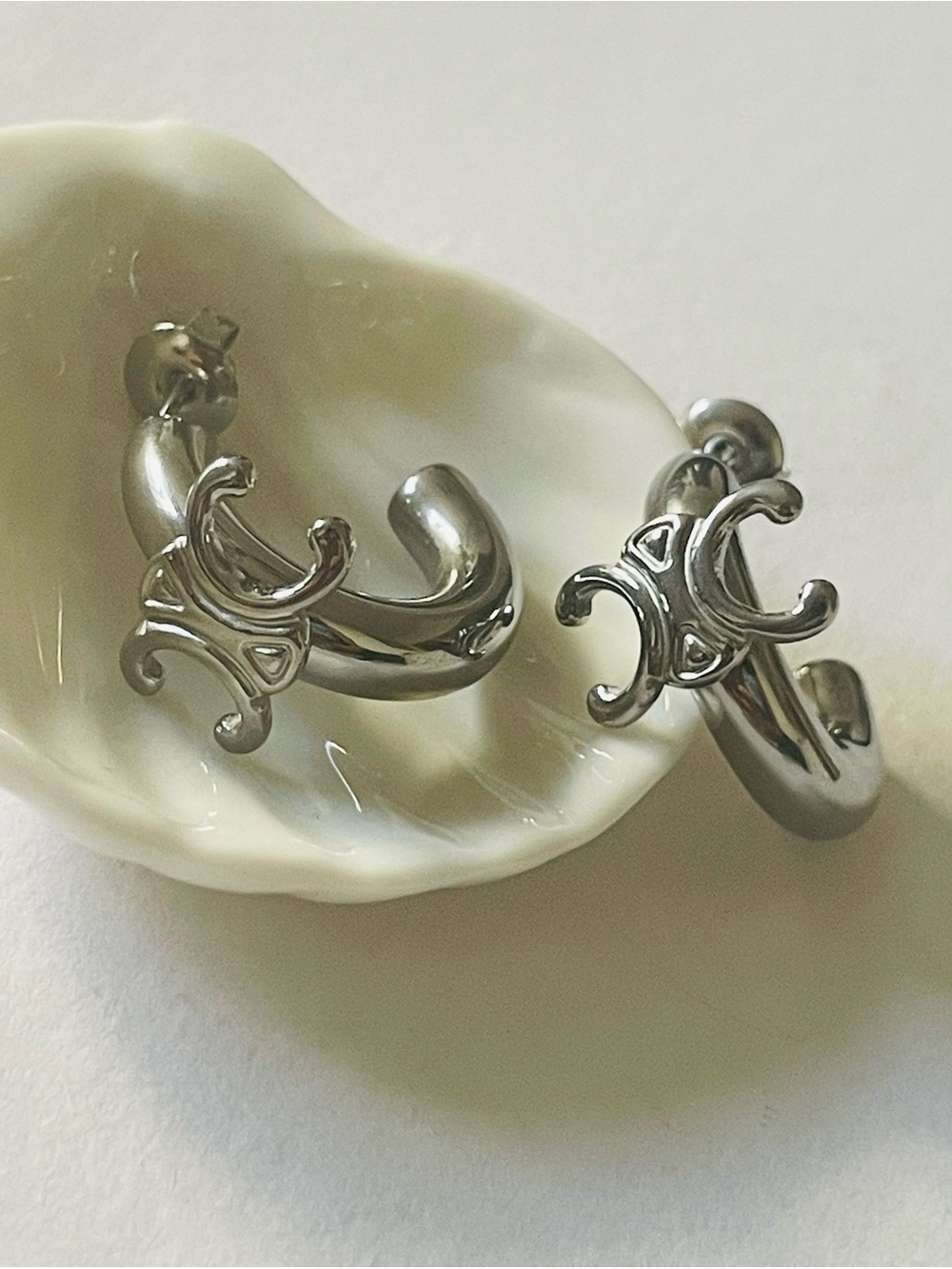 Silver Tone Hoop Earrings with Decorative Double C logo Motif